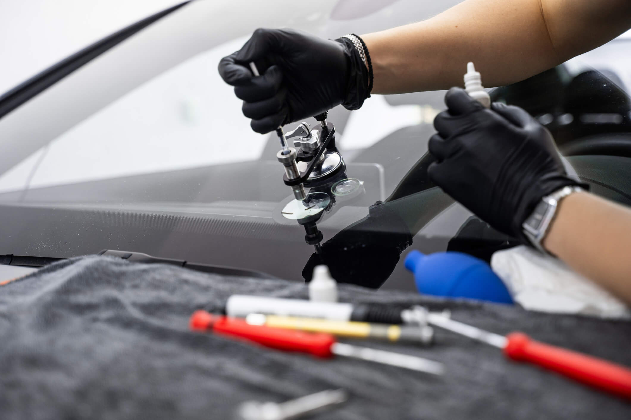 Auto glass repair in progress